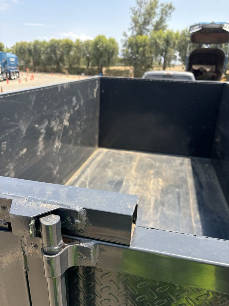 Clean, empty dump trailer ready for the next junk removal job